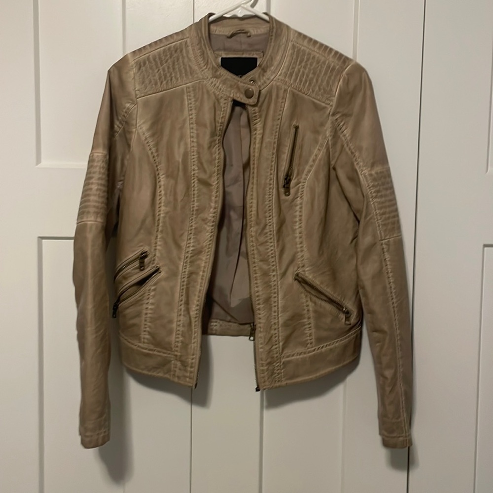 Maurice’s tan jacket
